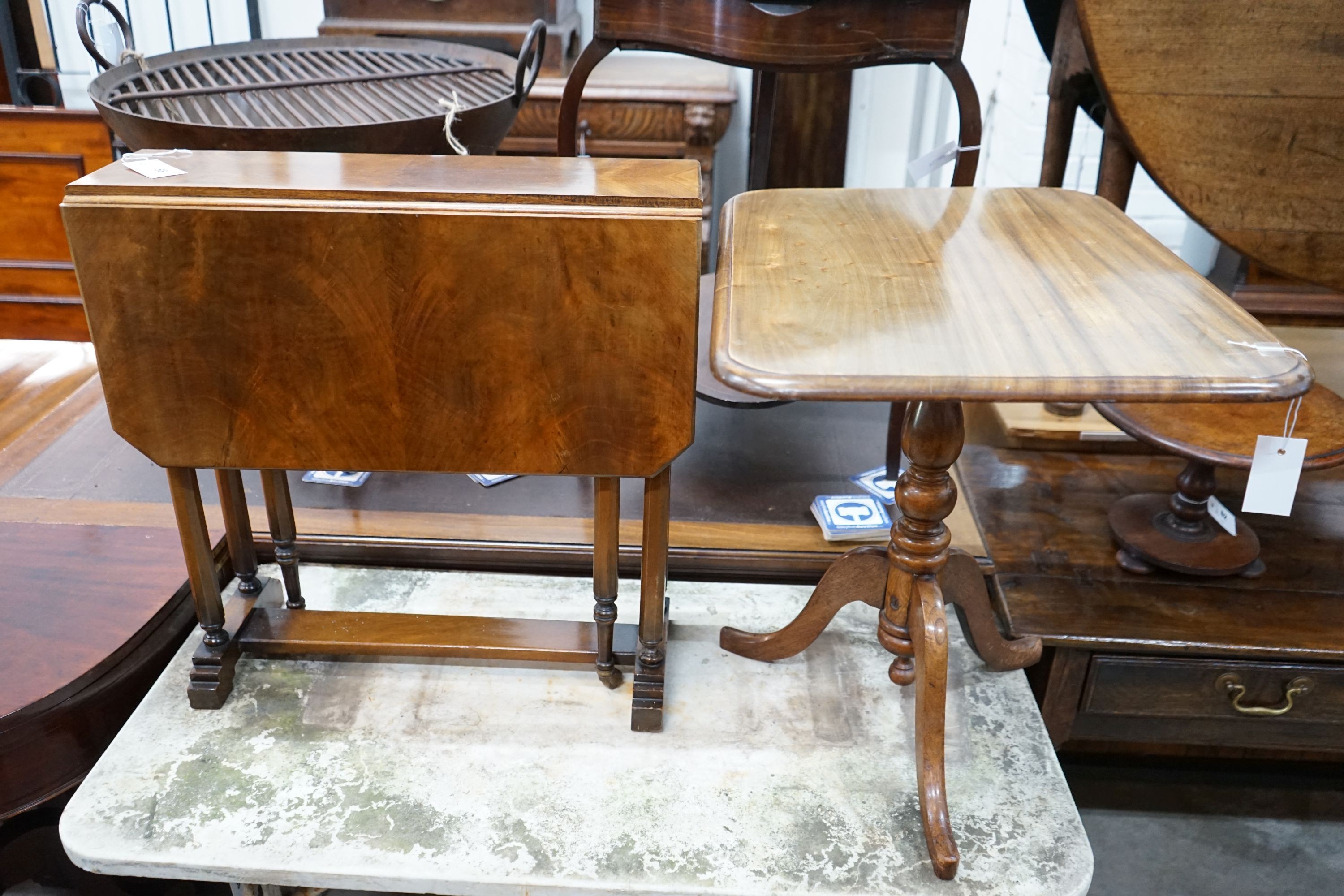 A Victorian mahogany tripod wine table, cut-down, width 60cm, height 56cm together with a Sutherland table